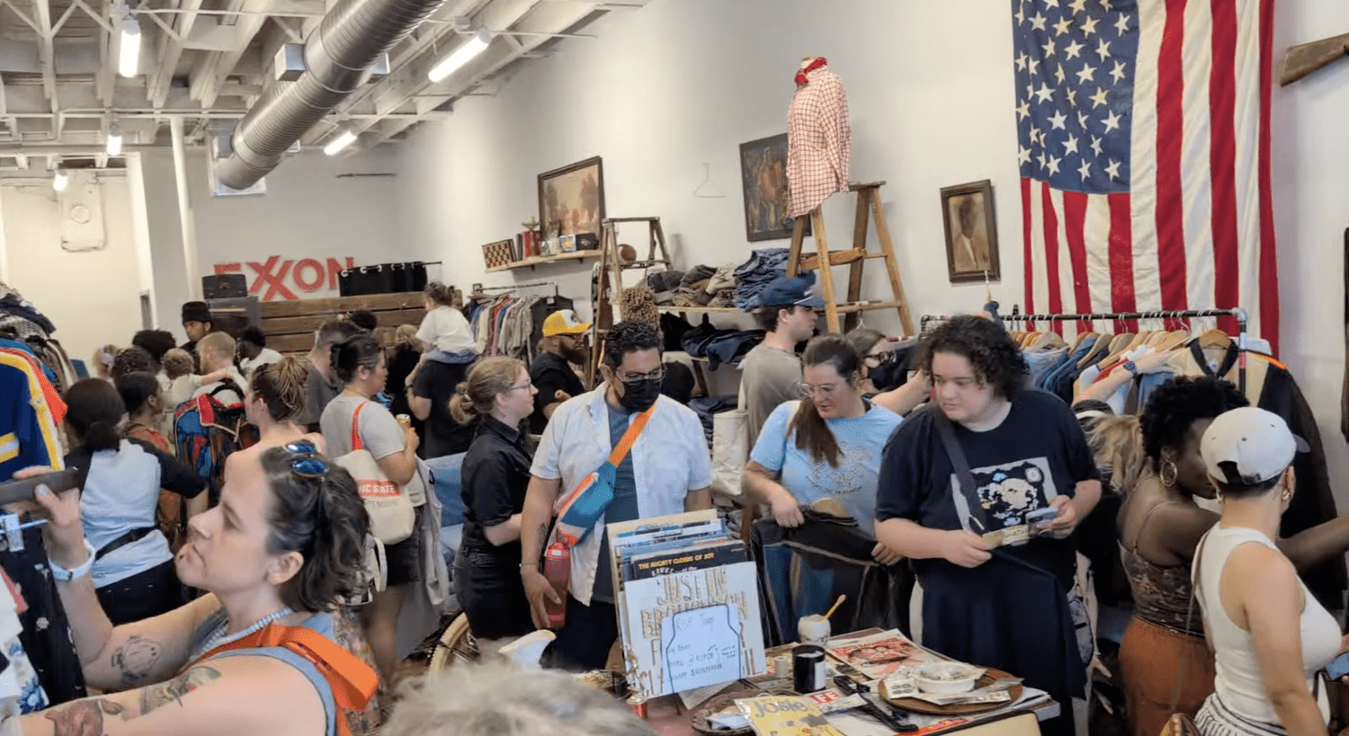 Shoppers discovering clothes at Middle of May Vintage Thrift